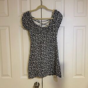 Black and white floral dress. Straps in the back. Very summer.